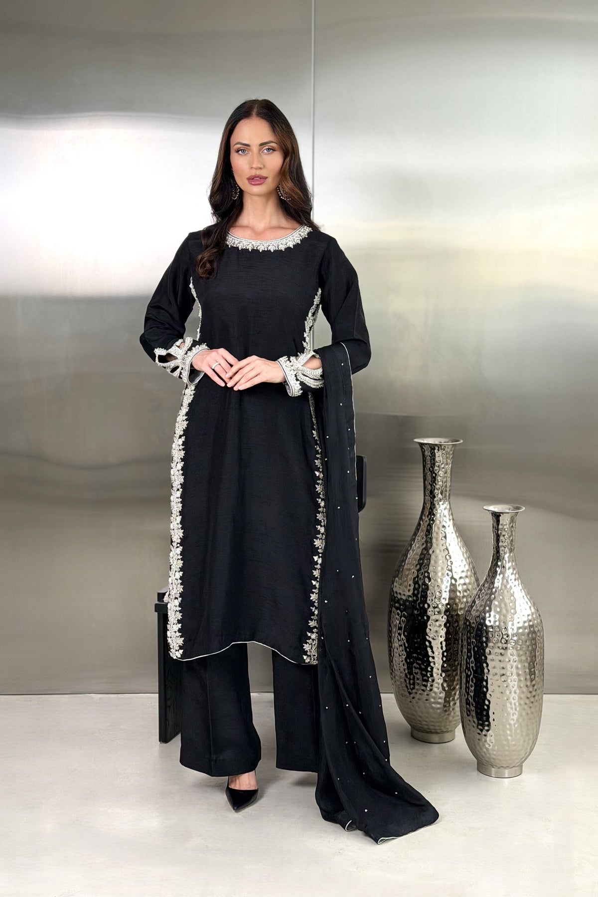 Black and silver three-piece suit by To Jan